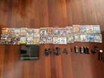 PlayStation 3 com 30 jogos e alguns acessórios