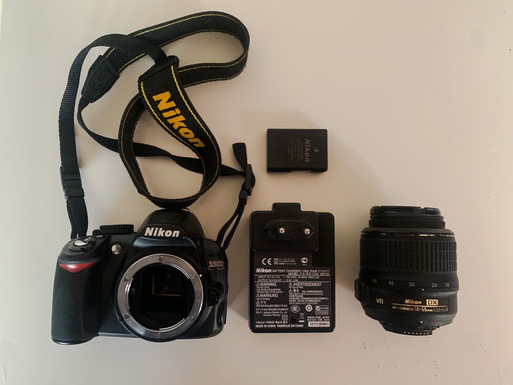 Nikon D3100 + objetiva