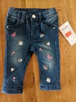 Spodnie jeansowe dla dziewczynki, w kwiatki, nowe, Kik, rozmiar 68