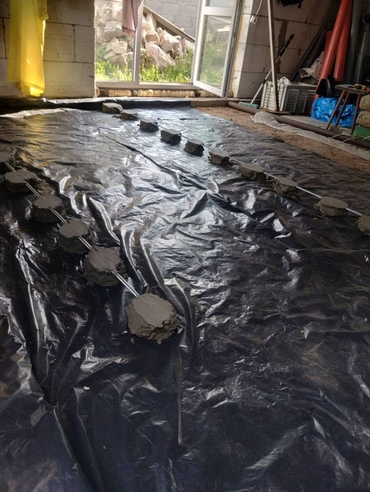 Стяжка пола под  кафель и ламинат