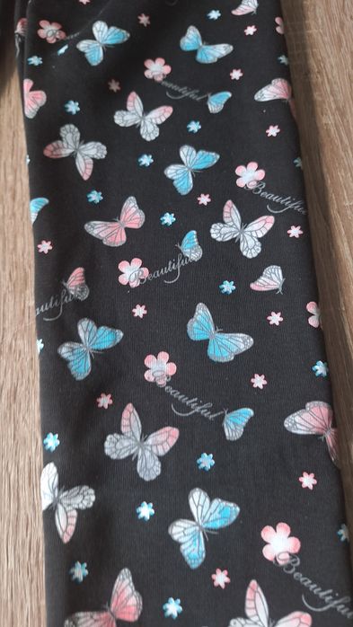 Leginsy ocieplane czarne z motylkami 152/158