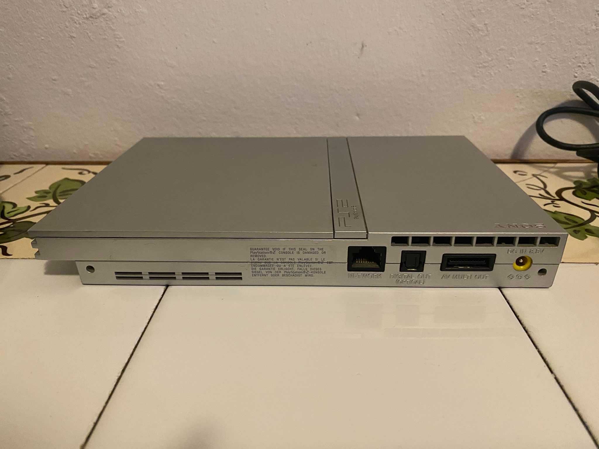 Playstation2 com cabos, comando, jogos e microfone