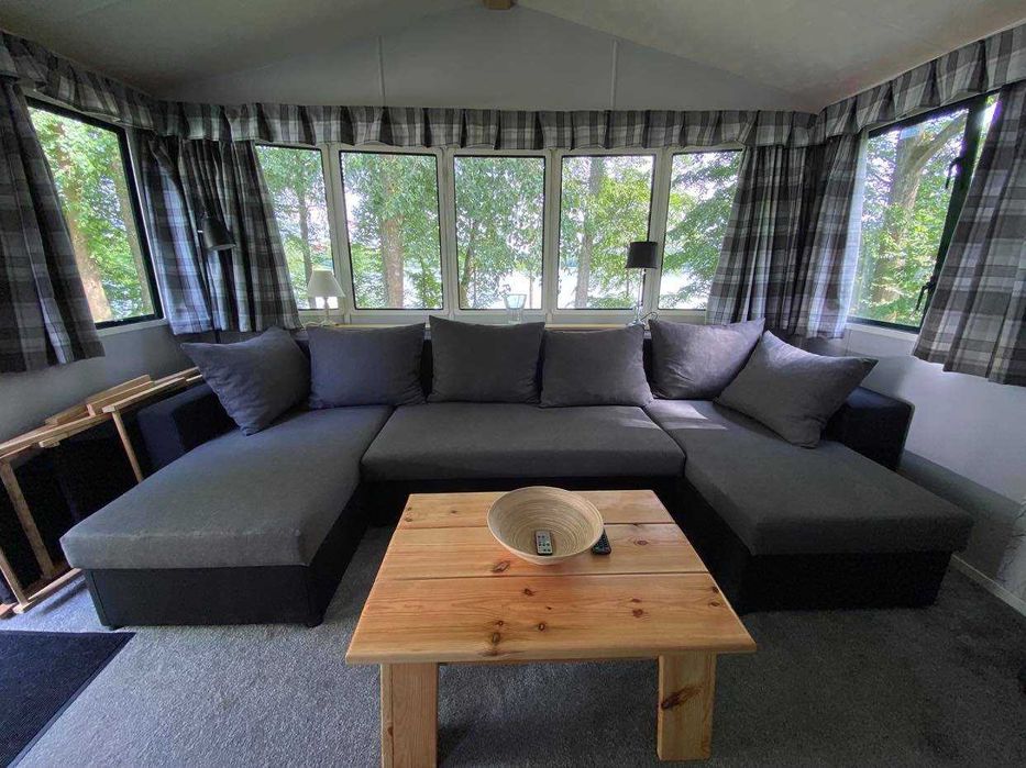 Domek nad jeziorem Ublik Wyszowate linia brzegowa pomost łódka