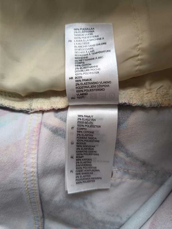 Kolorowe spodnie H&M z abstrakcyjnym wzorem - rozmiar 38