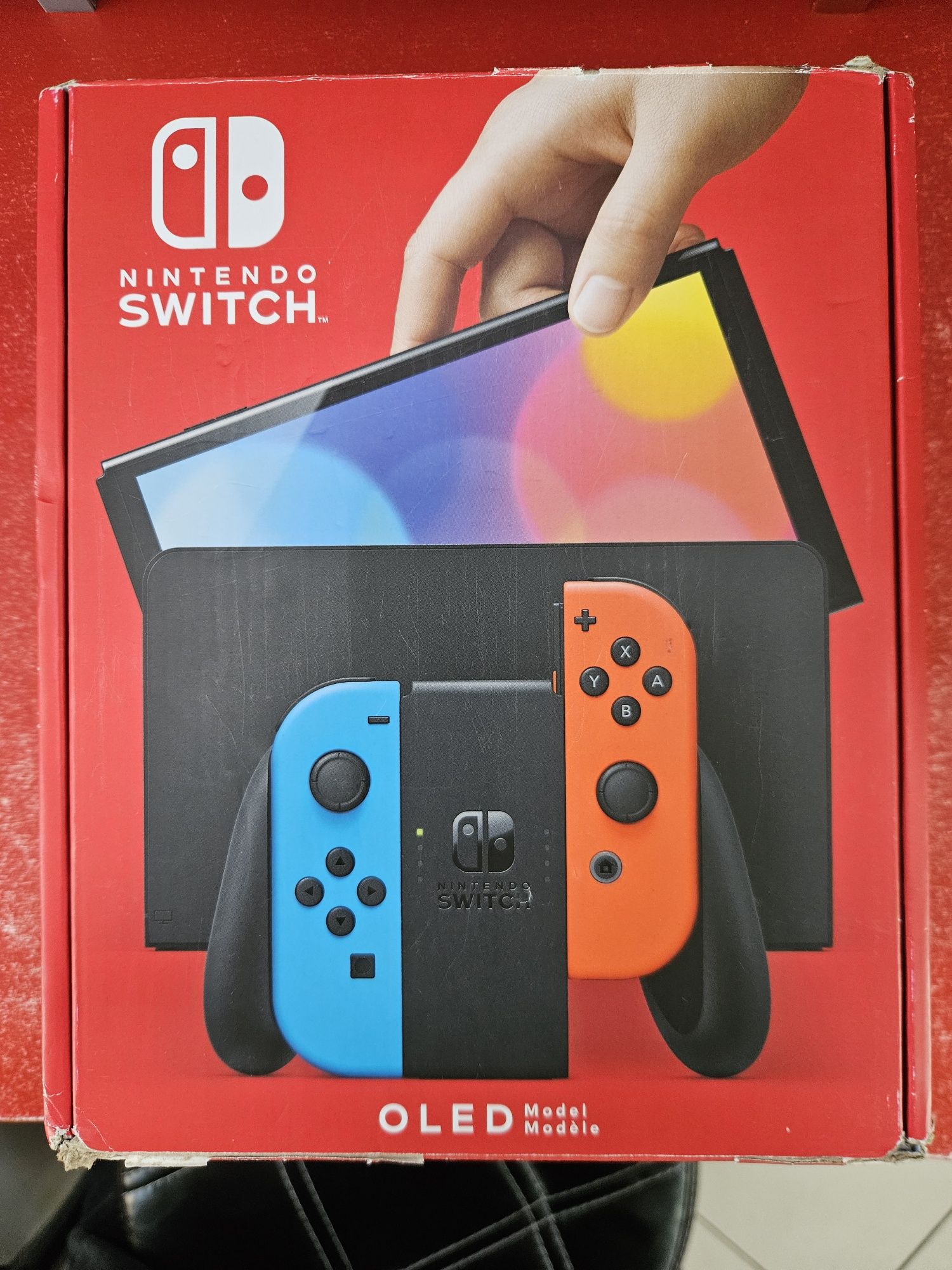 Nintendo Switch OLED with Neon Blue and Neon Red Joy-Con