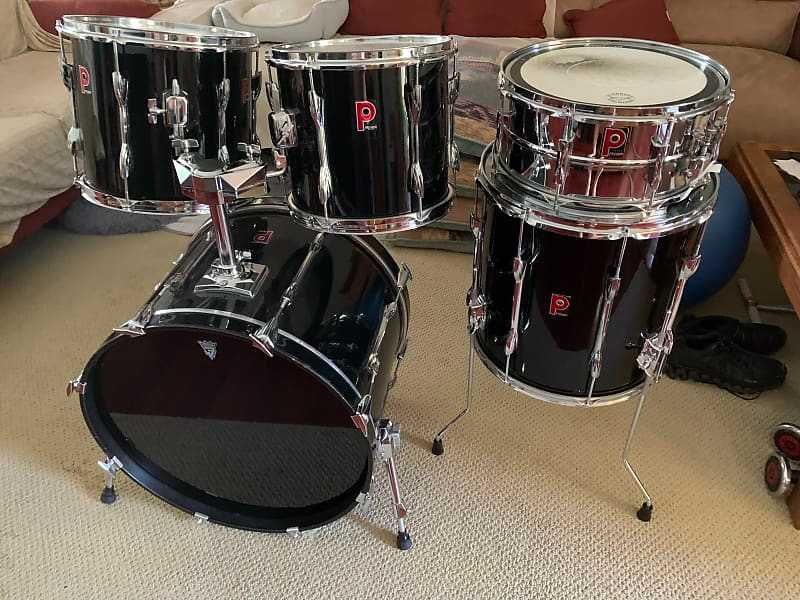 Bateria preta Premier com pratos extra e banco