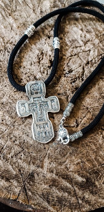 Срібний хрест на шовковому шнурку