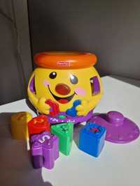 Garnuszek na klocuszek Fisher Price