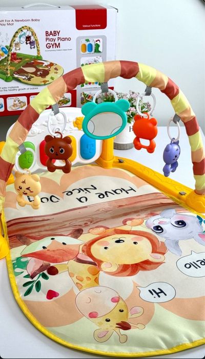 Килимок з брязкальцями та піаніно