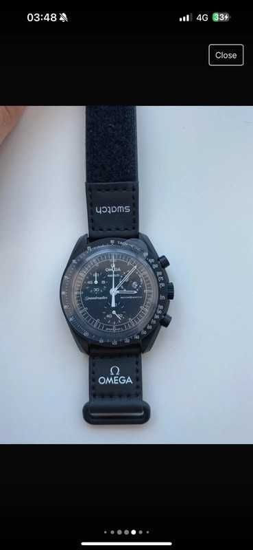 SO33B700 Omega x Swatch Snoopy：Czarny Zegarek Peanuts