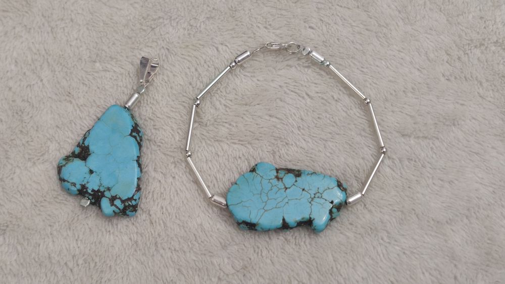 Komplet srebrnej biżuterii - bransoletka i wisiorek