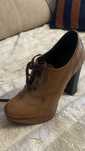 Botas em pele salto alto