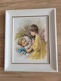 Obrazek aniołka nad dzieckiem