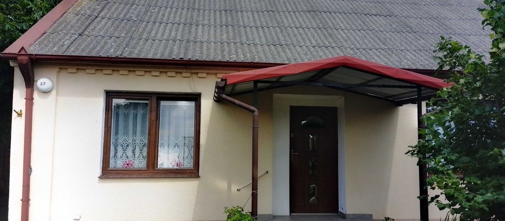 Mieszkanie z budynkami gospodarczymi