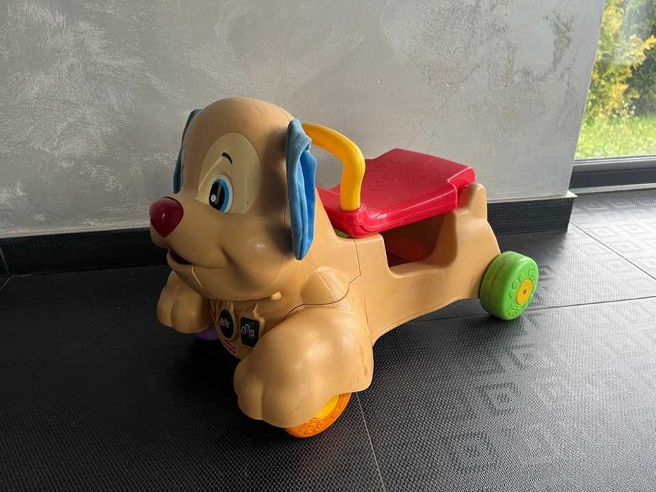 piesek fisher price jeździk