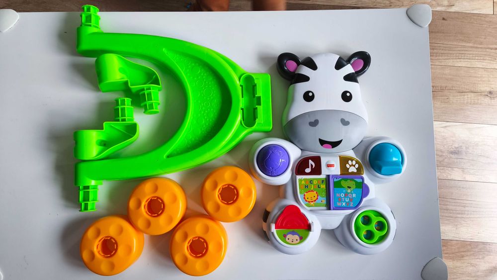 Interaktywny pchacz Zebra Fisher-Price wersja niemiecka chodzik