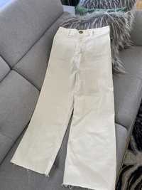 Beżowe spodnie z szerokimi nogawkami Bershka