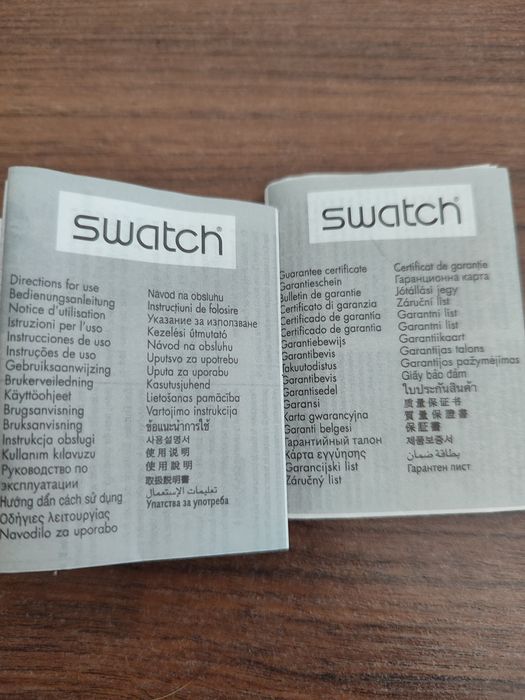 Relógio bracelete Swatch (branco e lavanda)