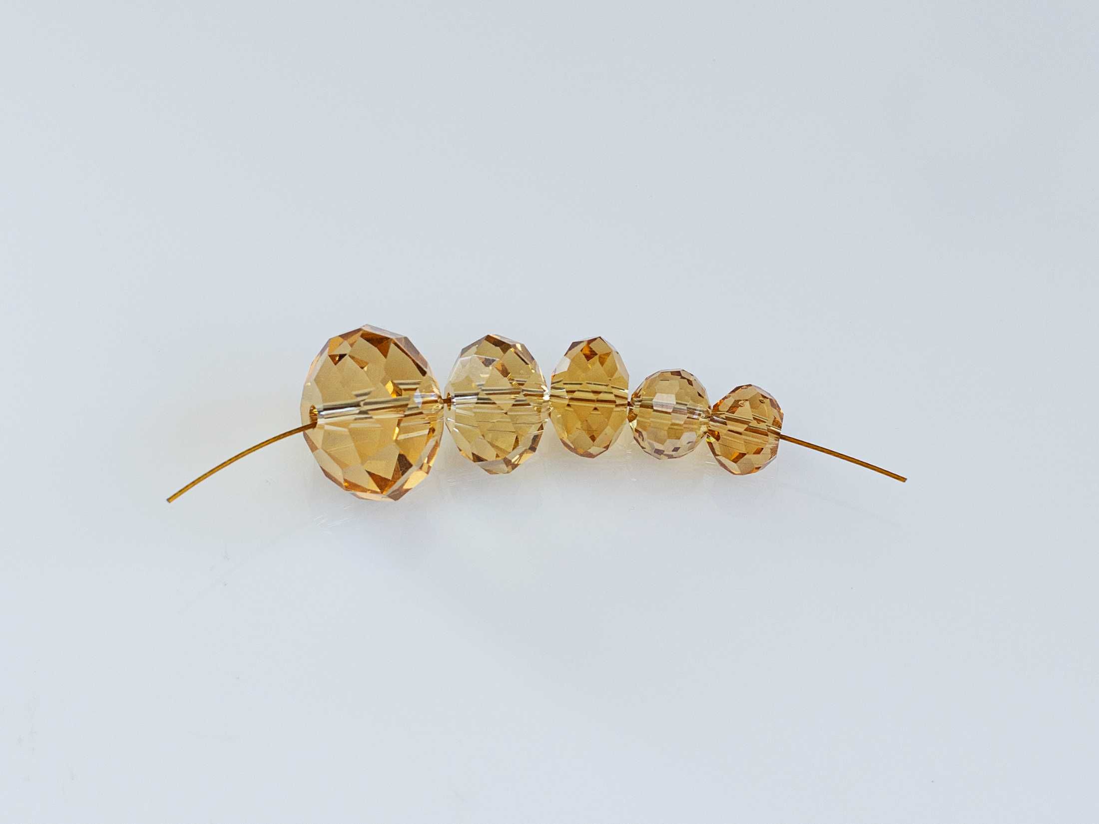 Kryształki 8x6mm Lt.Topaz do tworzenia biżuterii komplet 20 sztuk