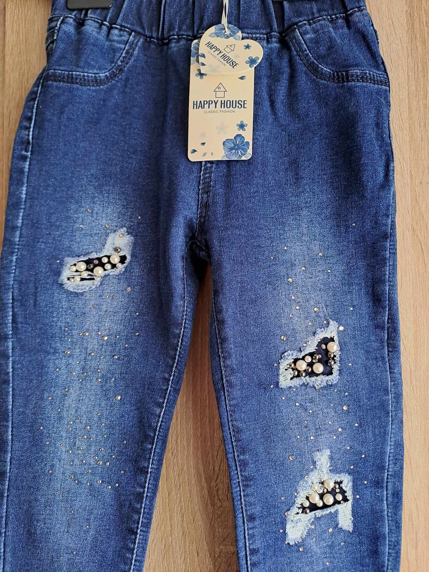Nowe spodnie jeansowe rurki z przetarciami