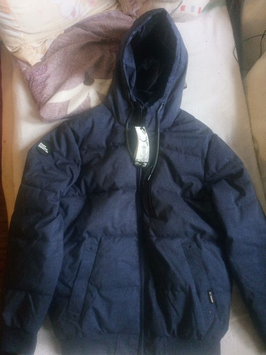 Продам новый мужской пуховик