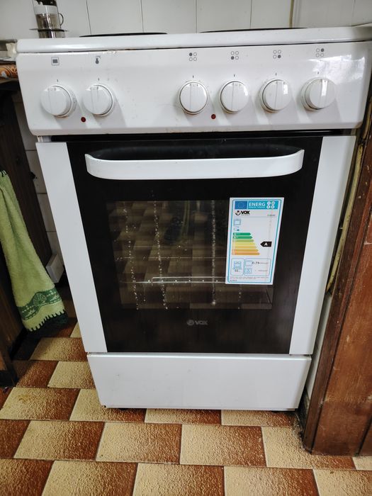 Fogão elétrico com quatro discos e forno