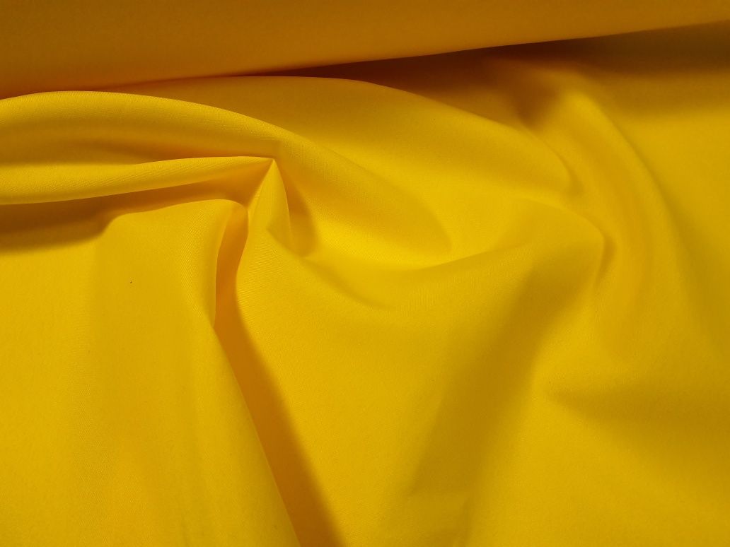 Tkanina poliester żółta szer.ok.100-105 cm.