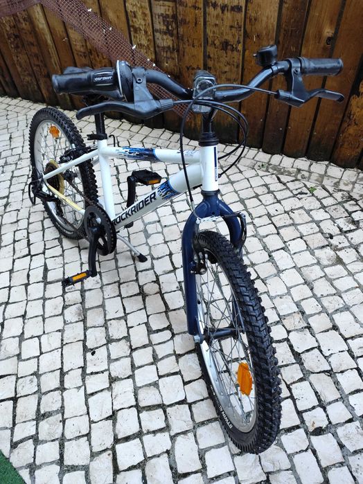 Bicicleta e criança ROCKRIDER  ST120 20" 6-9 ANOS branco e azul
