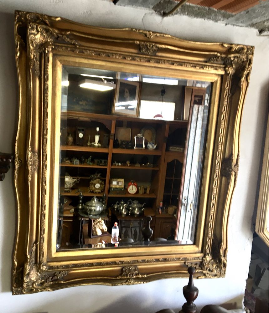 Espelho antigo em talha dourada biselado