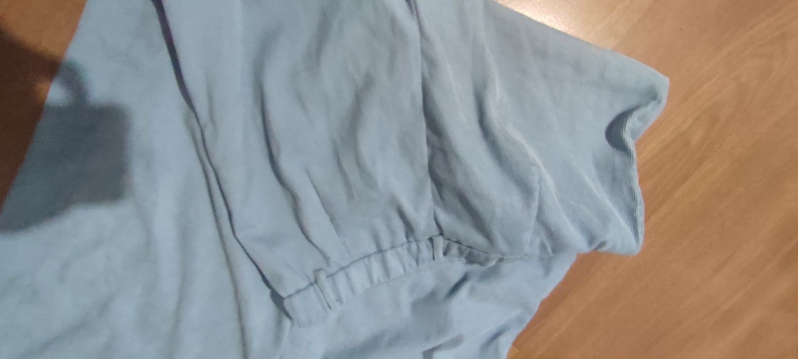 Jasnoniebieskie spodnie w prążki z kieszeniami,szerokie nogawki