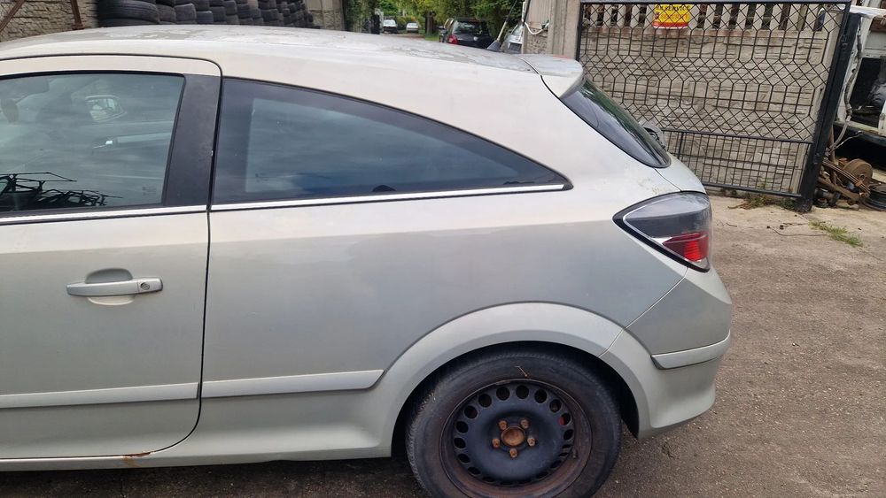 OPEL ASTRA H GTC BŁOTNIK LEWY TYŁ Z167