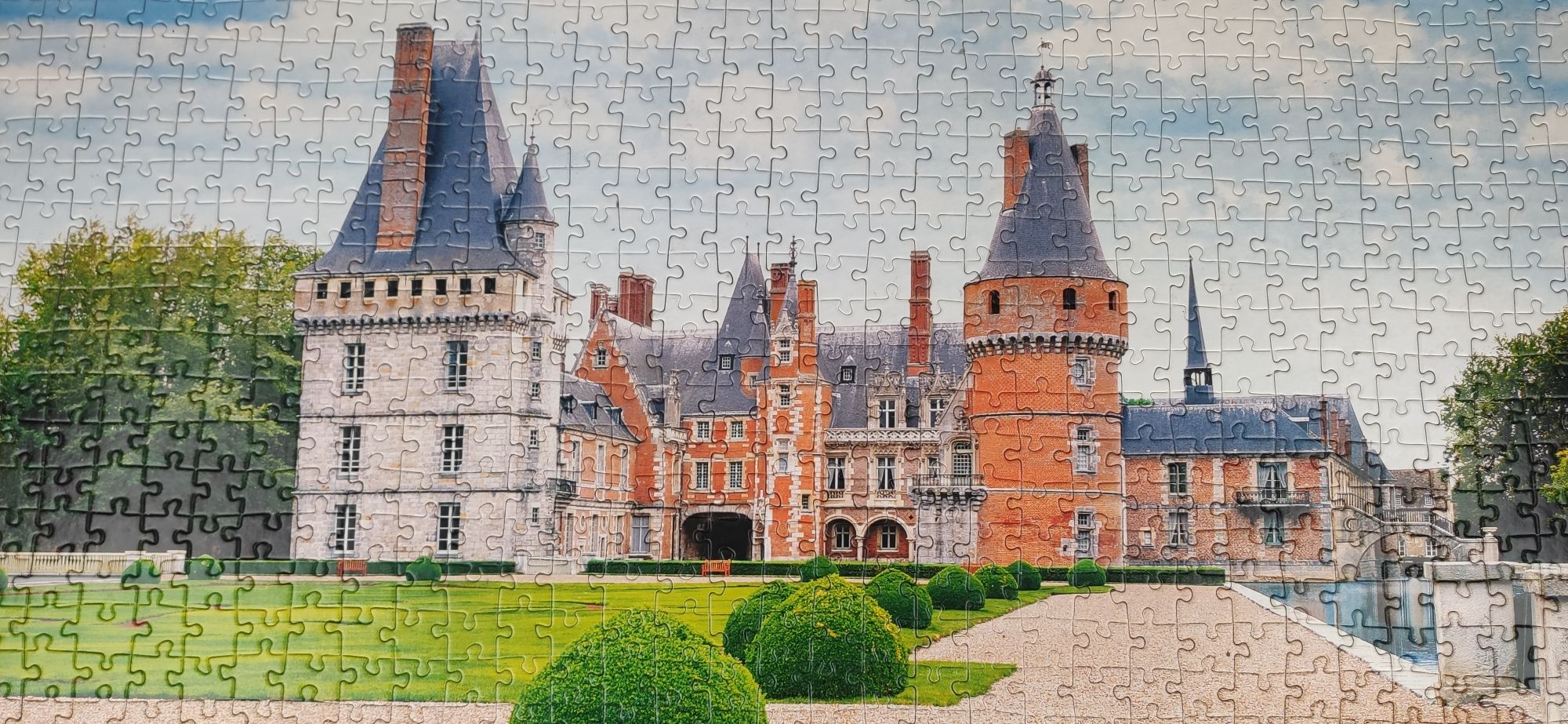 Puzzle obrazek zamek pałac ułożone na desce 70x30 cm