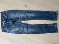Spodnie jeansy z przetarciami
