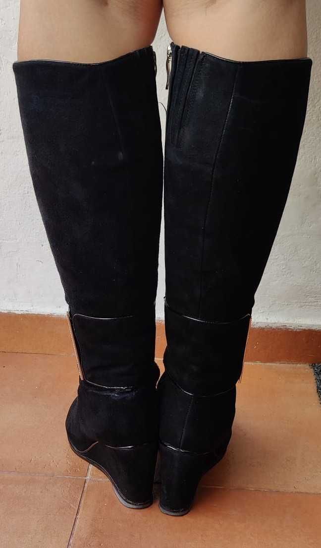 Botas em pele femininas