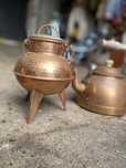 Panelas e bules em cobre