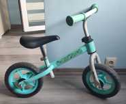 Rowerek biegowy 10" miętowy dinozaury