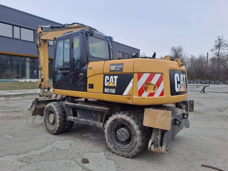 Колісний екскаватор CAT 315 Atlas