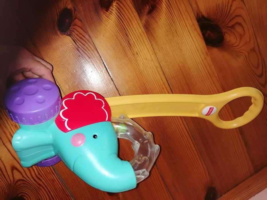 Jeździk Jeżdżący słonik z piłeczkami Fisher Price, chodzik nauka chodz