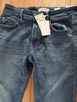 Nowe spodnie męskie jeansy Reserved 31