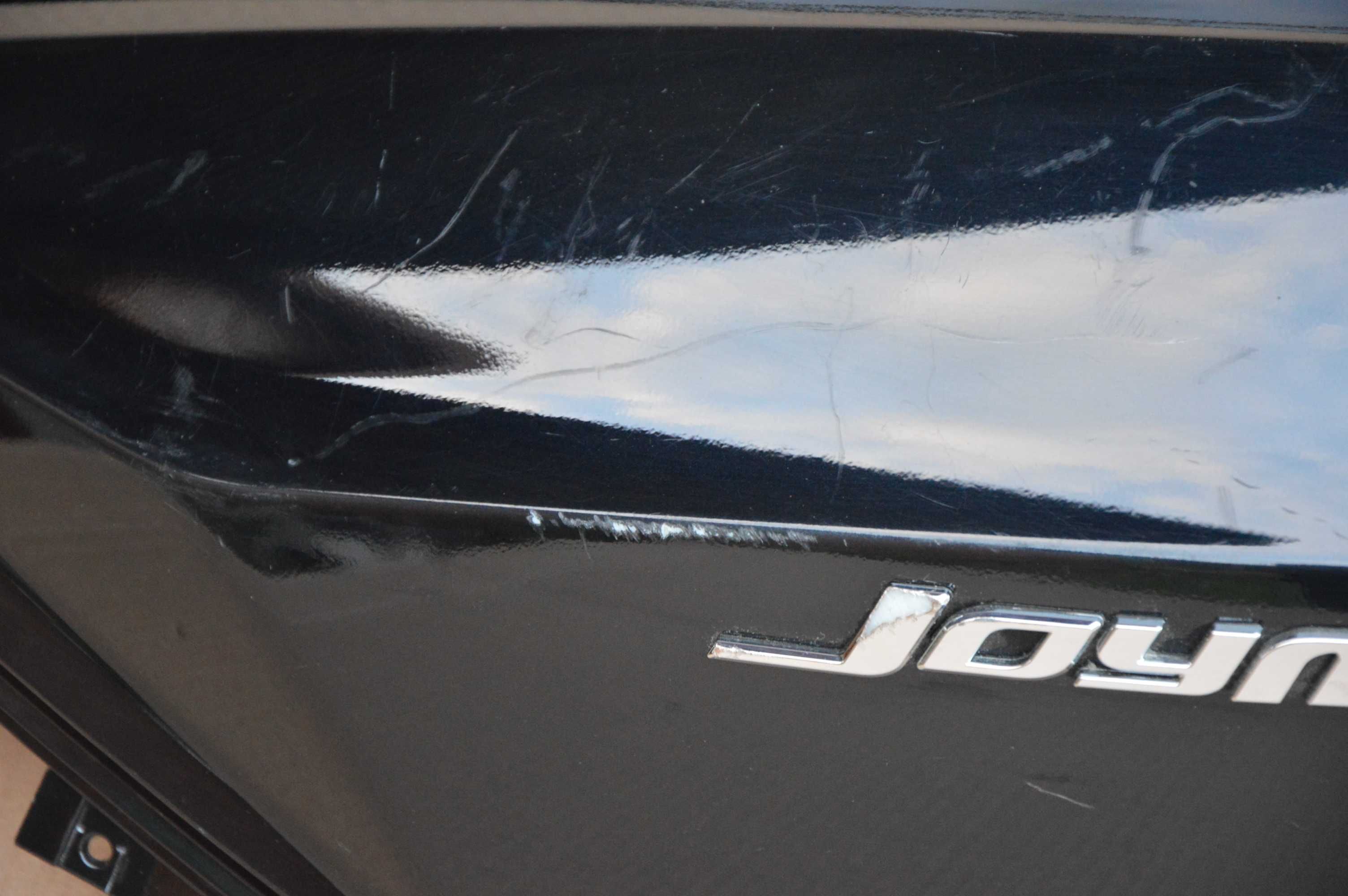 SYM gts Joymax 125 -12r OWIEWKA lewa ogon zadupek emblemat