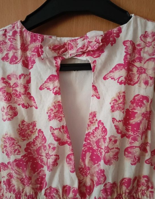 Sukienka w kwiatki dla dziewczynki Pepco, rozmiar 116.