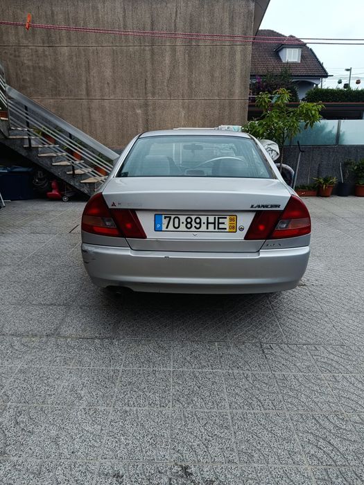 Mitsubishi Lancer 1.3 AC 4P acidentado na lateral