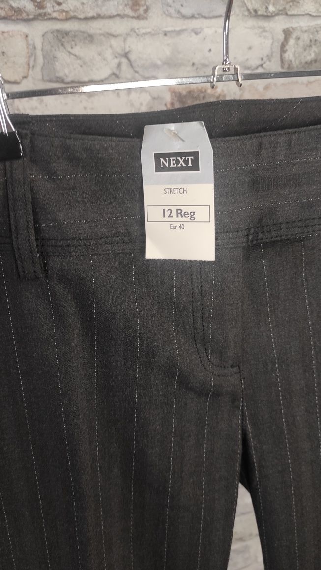 Nowe damskie eleganckie spodnie z kantem i z prostą nogawka