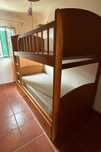 Cama beliche com arrumação