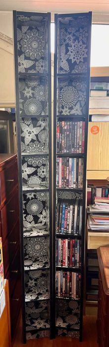 Conjunto de DVDs + Estantes