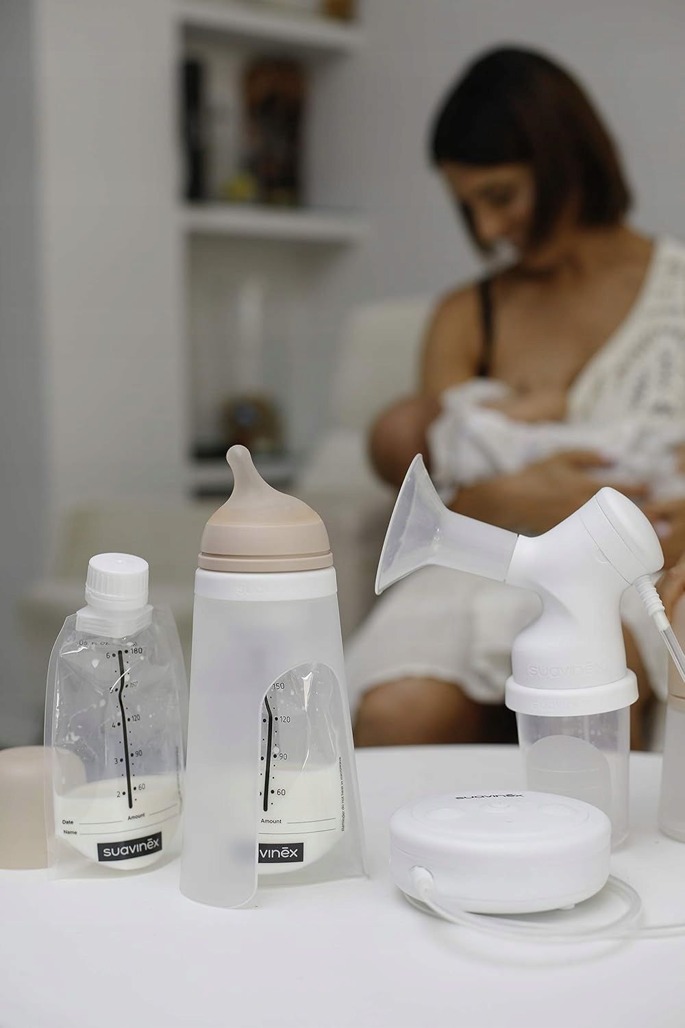 Elektryczny laktator Suavinex + 3 woreczki na mleko 180 ml