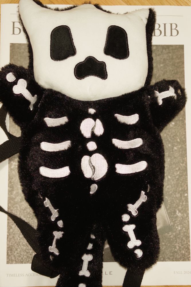 Black skeleton cat bag