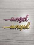 Dwie spinki z napisem ,,angel''