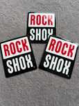 3 naklejki firmy Rock Shox. Wymiary - 65 mm x 75 mm
