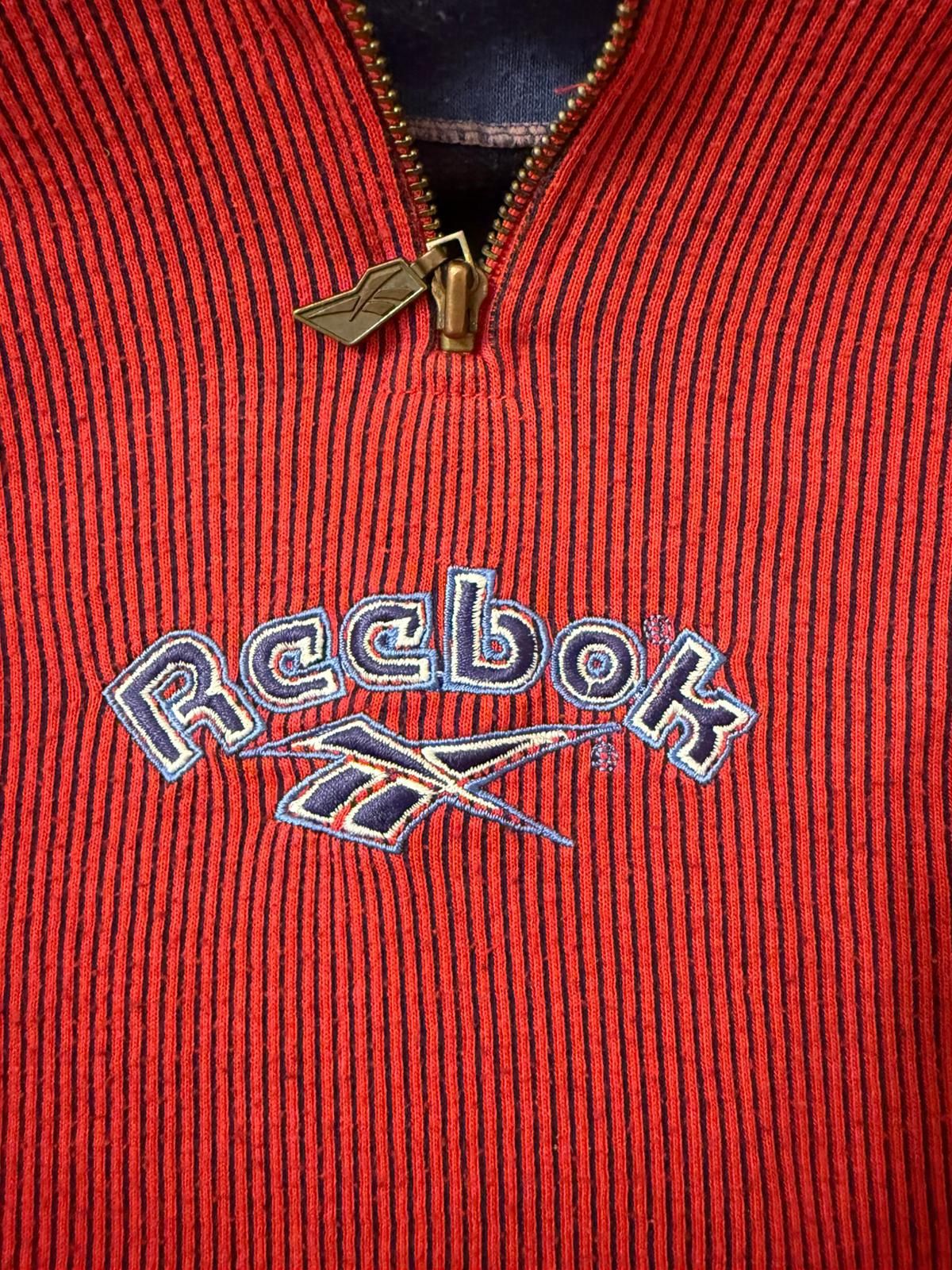 Krótka bluza z kapturem, Reebok 
Rozmiar 14 (wg mnie M)
Skład 65% poli